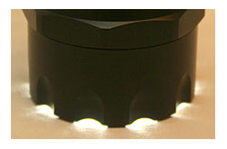 A scalloped head allows the user to immediately tell if the flashlight was left on, preventing the needless drain of batteries.