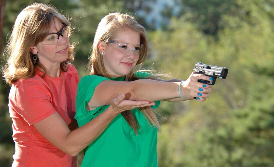 mom daughter pistol shoot
