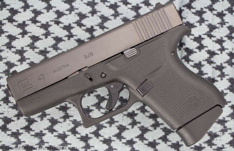 In this picture, we see the Glock model 43 handgun from the left side. Originally designed by Gaston Glock, Glock is a brand of polymer-framed, short recoil-operated, locked-breech semi-automatic pistols designed and produced by Austrian manufacturer Glock Ges.m.b.H. After his death, his wife, Kathrin Glock took over the company.
