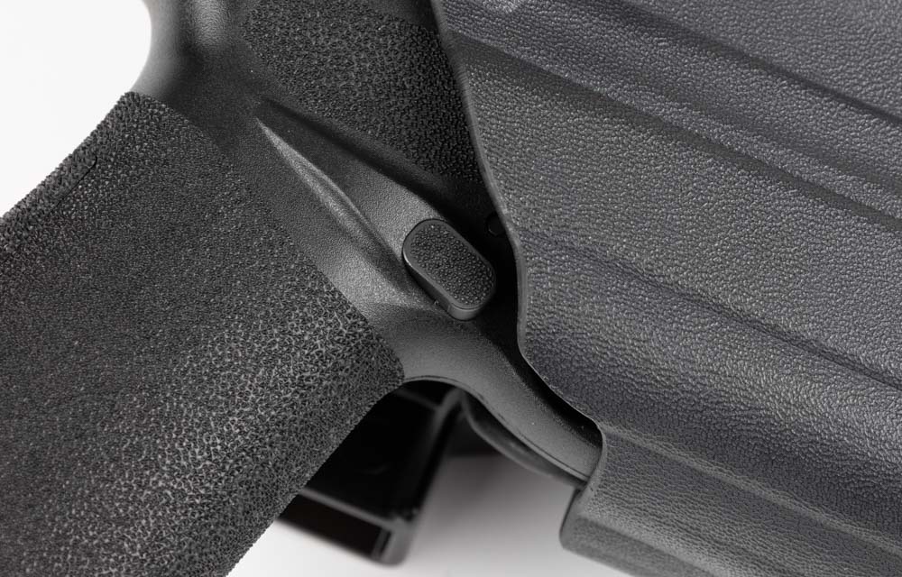 exposed magazine release with comp-tac holster