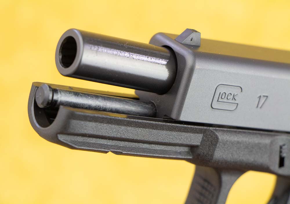 In this digital image, we see the hardened forged steel slide on the polymer frame of the Glock 17. We can also see the polymer guide rod which is part of the captive recoil spring assembly. One of the early polymer frame 9mm pistols, the Glock 17 offers more than four decades of evidence of performance under harsh conditions. The guns are reliable with any ammo I've tried making it one of the best full-size 9mm semi-automatic handguns available. Although I like the OEM pasts, there are a ton of aftermarket parts available for your new pistol such as a new magazine release, an upgraded front sight, a reversible magazine catch, a number of muzzle devices and upgrades to the magazine well to make the gun easy to control in a self defense or dozen different situations. 