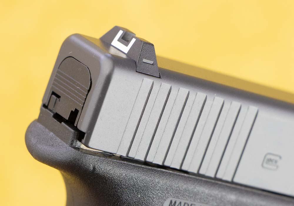 In this photograph we can see the slide and sights installed on the Glock 17. Pistol sights are a highly personal thing with some people preferring simple black mil-spec style while others preferring night sights or even a red dot sight. The factory Glock sights are good. However, if you want to upgrade there are some excellent options like the Ameriglo night sights. If you have a pistol with the MOS system on the slide, adding an optic is easy. And let's face it, a red dot reticle is fast and easy to use under pressure. Something to consider is the MOS Model comes with 17-round factory magazines just like the other G17 pistols.