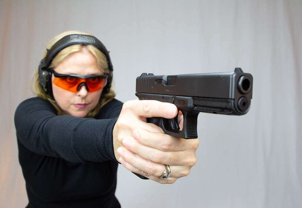 In this photo we see a beautiful woman shooting a Glock 17 pistol. The original G17 was designed by Gaston Glock for the Austrian Army. However, the gun has since proved to be very effective for men and women in every walk of life. From police officers and deputy sheriff's to moms and dads protecting their children, concealed carriers find the guns to be reliable and accurate. The controls are easy to reach and easy to engage. They don't require esoteric gun knowledge to keep them running safely and they are much easier to carry than an AR-15 or shotgun. 